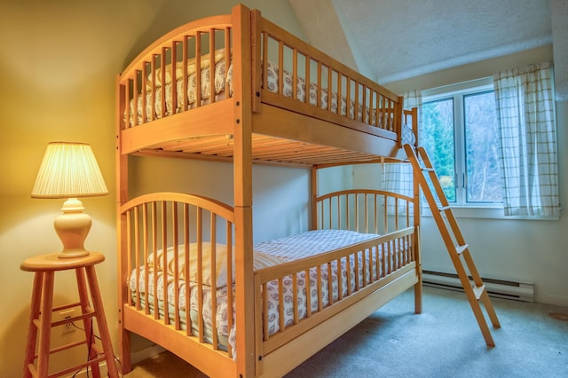 carpeted bedroom featuring baseboard heating and vaulted ceiling