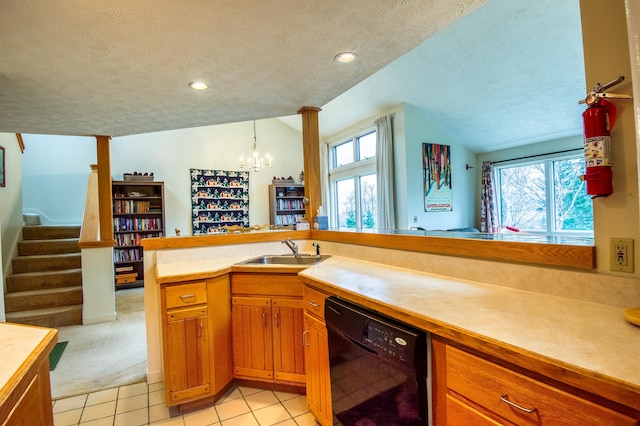 kitchen with a textured ceiling, sink, lofted ceiling, and black dishwasher