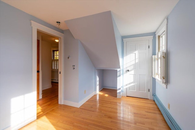 entrance foyer with light hardwood / wood-style floors and a baseboard radiator