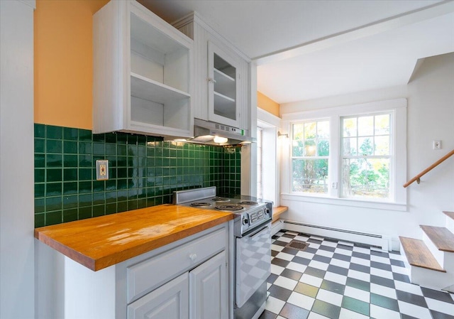 kitchen featuring a baseboard heating unit, butcher block counters, tasteful backsplash, stainless steel stove, and white cabinetry