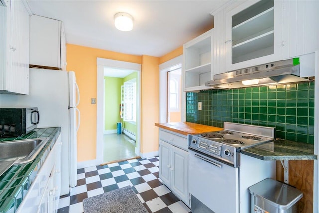 kitchen featuring range hood, white cabinets, stove, butcher block countertops, and decorative backsplash