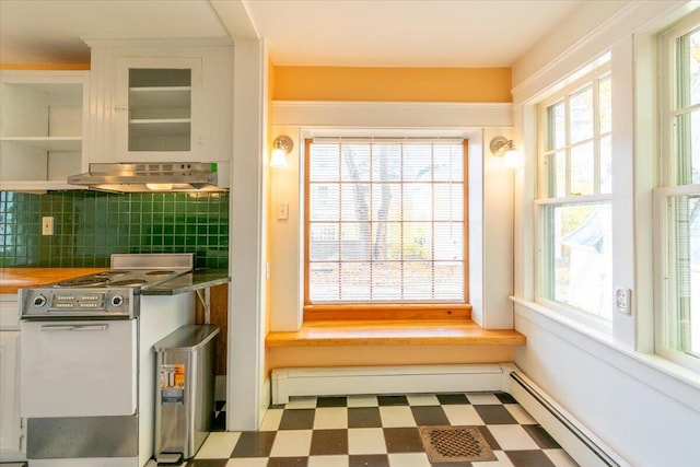 interior space featuring white cabinetry, a wealth of natural light, and decorative backsplash