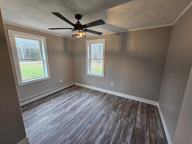 empty room featuring ceiling fan, wood-type flooring, a textured ceiling, and a baseboard radiator