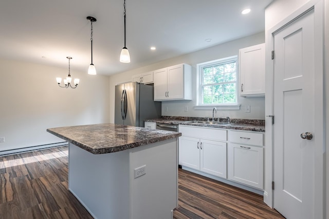 LOT5 Clarks Bridge Rd, Waterboro, ME 04087 - kitchen featuring appliances with stainless steel finishes, dark countertops, white cabinets, a kitchen island, and dark wood-style floors