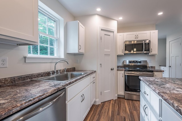 LOT5 Clarks Bridge Rd, Waterboro, ME 04087 - kitchen with stainless steel appliances, dark wood finished floors, dark countertops, white cabinets, and recessed lighting