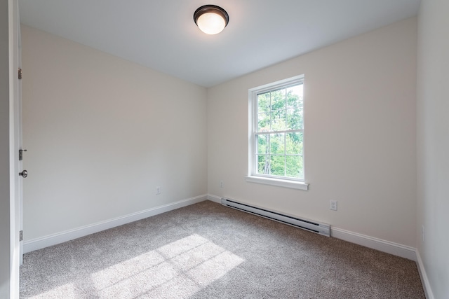 carpeted empty room with a baseboard radiator