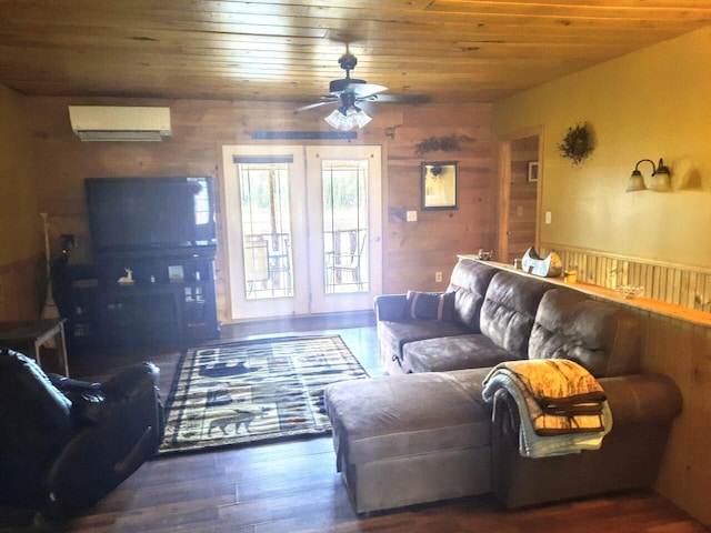 living room featuring wood walls, wood ceiling, a wall mounted air conditioner, dark wood-type flooring, and ceiling fan