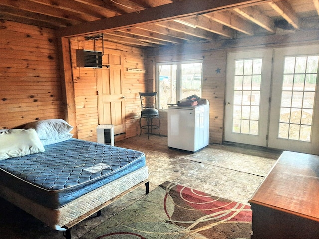 bedroom featuring fridge and wooden walls