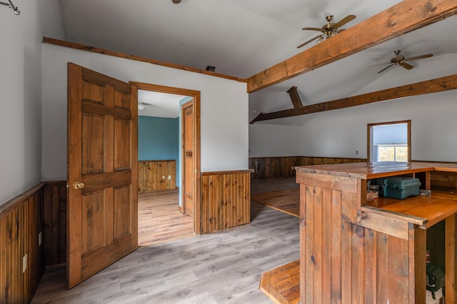 kitchen with light hardwood / wood-style floors, wood walls, butcher block countertops, ceiling fan, and lofted ceiling with beams