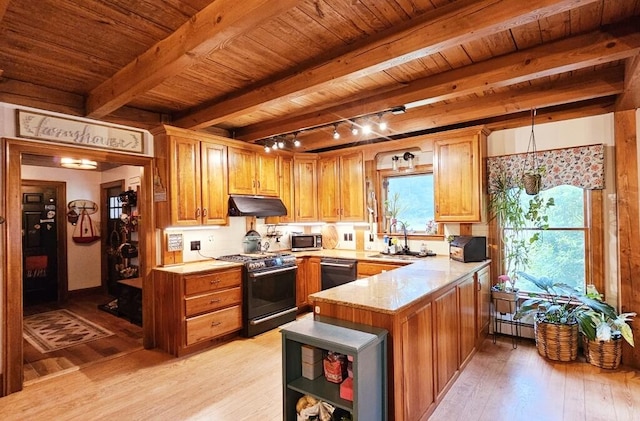 kitchen with sink, appliances with stainless steel finishes, pendant lighting, beam ceiling, and light hardwood / wood-style floors