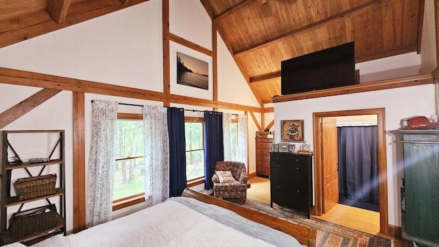 bedroom featuring wood ceiling, light hardwood / wood-style flooring, high vaulted ceiling, and beamed ceiling