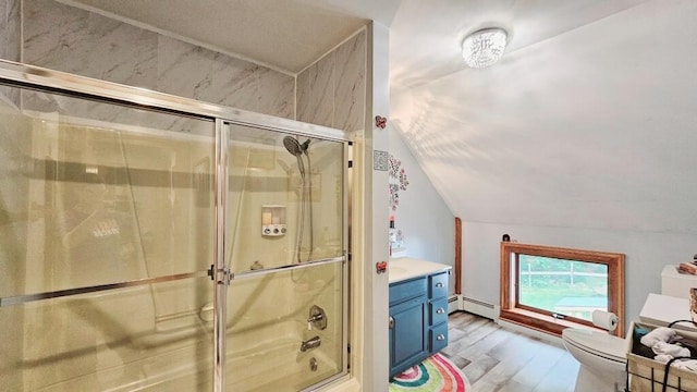 full bathroom featuring hardwood / wood-style flooring, enclosed tub / shower combo, vanity, baseboard heating, and toilet