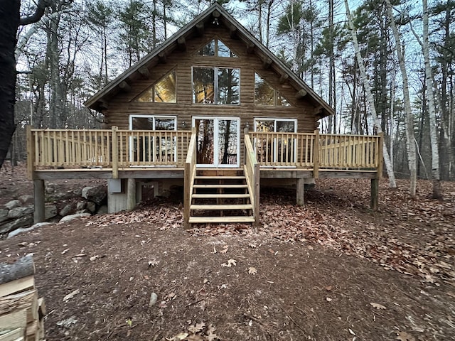 back of property featuring a deck