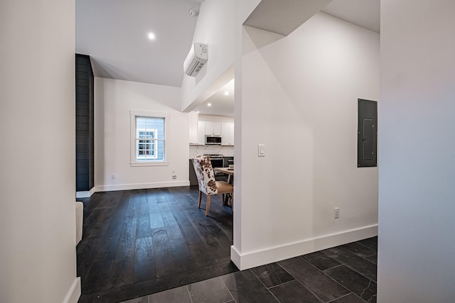 hall with dark hardwood / wood-style flooring, electric panel, and a wall unit AC