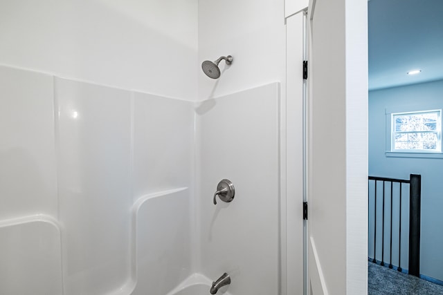 bathroom with shower / washtub combination