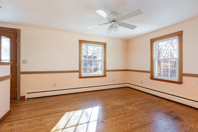 spare room featuring a healthy amount of sunlight and light wood-type flooring