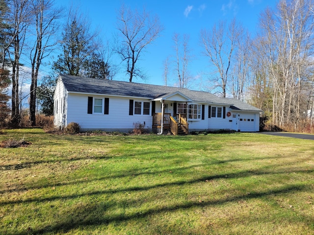 single story home with a garage and a front yard