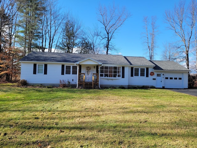 ranch-style home with a garage and a front yard