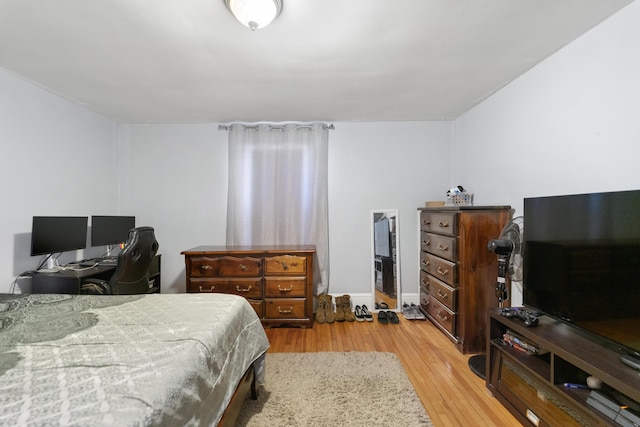 bedroom featuring light wood-style flooring