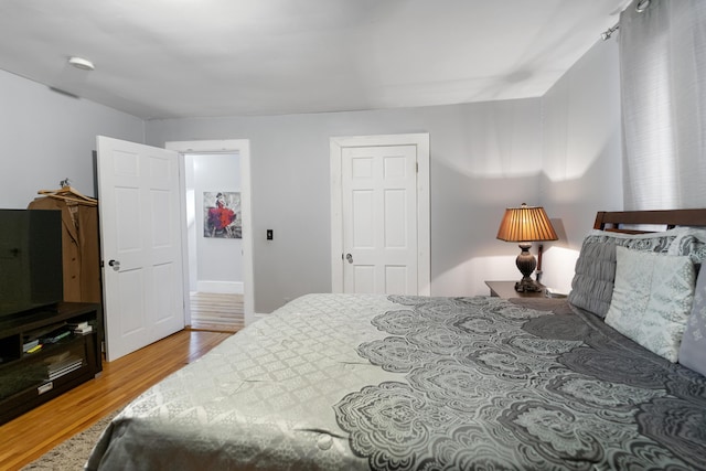 bedroom with wood finished floors