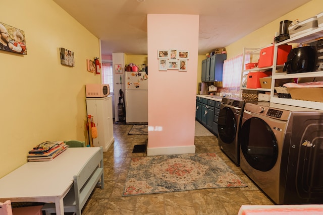 clothes washing area with washer and dryer