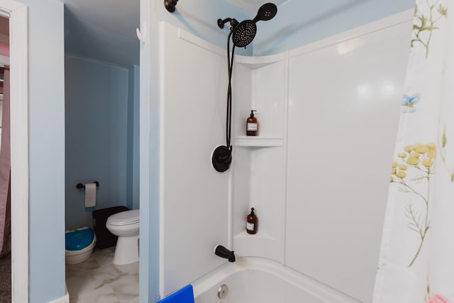 bathroom with tub / shower combination and toilet