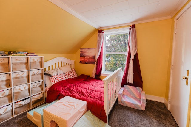 carpeted bedroom with vaulted ceiling