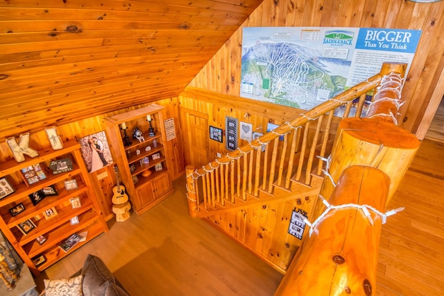8 Hilltop Hts, Rangeley, ME 04970 - staircase with wooden walls, vaulted ceiling, and wood finished floors