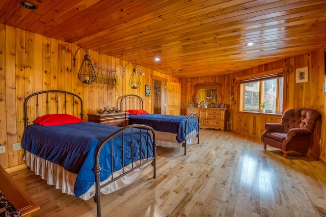 8 Hilltop Hts, Rangeley, ME 04970 - bedroom with wooden ceiling, wooden walls, and hardwood / wood-style floors