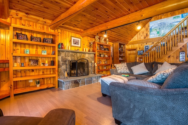 8 Hilltop Hts, Rangeley, ME 04970 - living room with wooden ceiling, hardwood / wood-style flooring, wood walls, a fireplace, and stairs