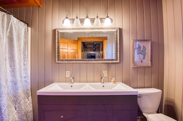 8 Hilltop Hts, Rangeley, ME 04970 - bathroom featuring double vanity, toilet, and curtained shower