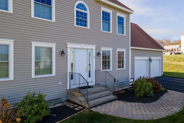 doorway to property featuring a garage