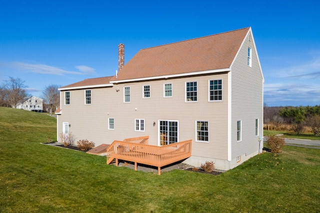 back of house featuring a yard and a wooden deck