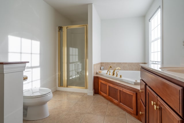 full bathroom with tile patterned flooring, shower with separate bathtub, vanity, and toilet