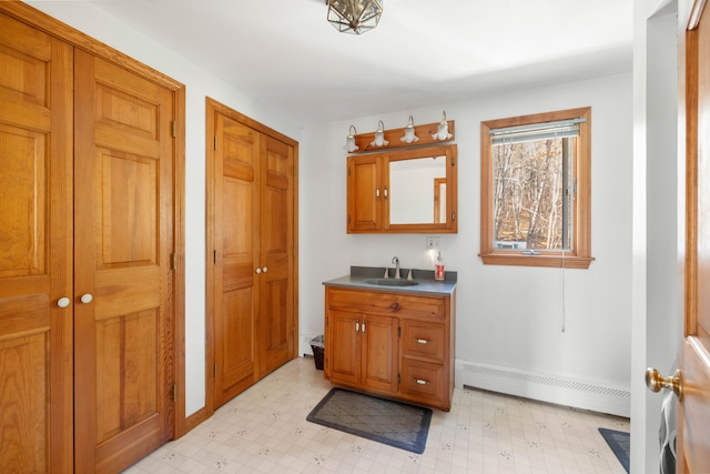 bathroom featuring vanity and a baseboard radiator