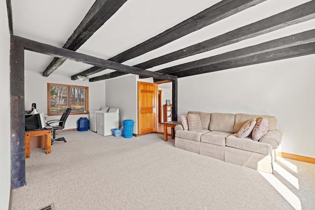 living room with carpet, independent washer and dryer, and beam ceiling