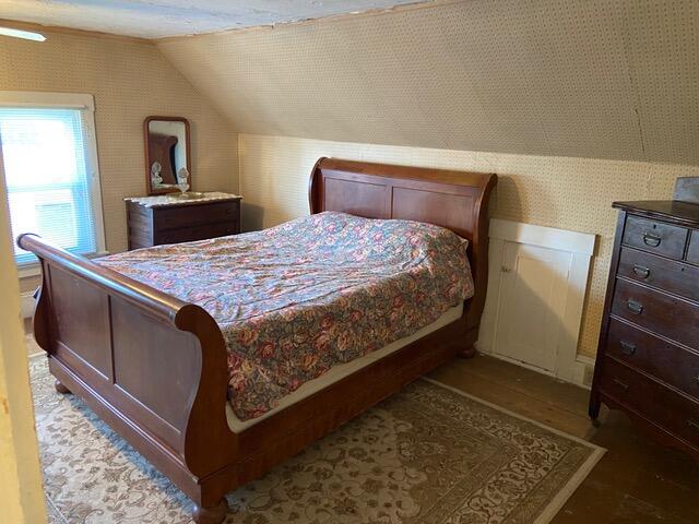 bedroom featuring vaulted ceiling