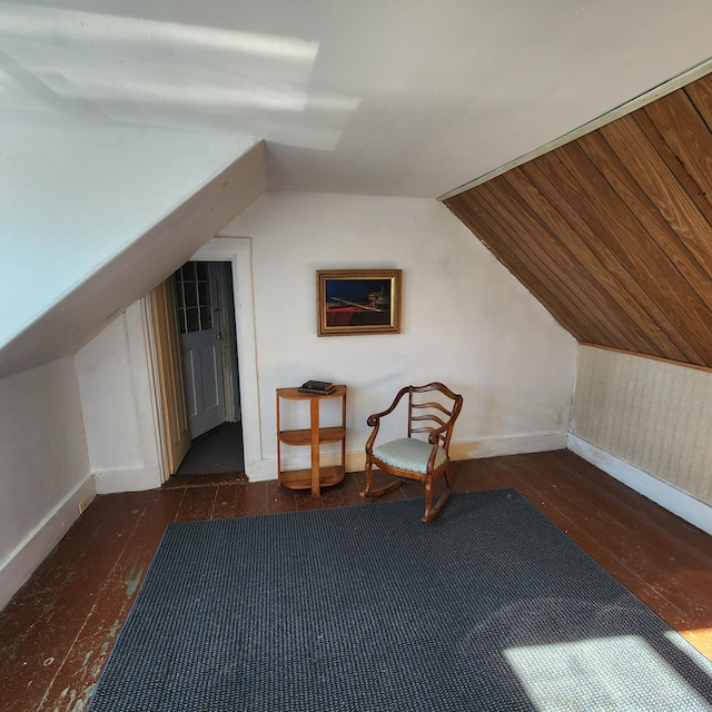 bonus room featuring dark hardwood / wood-style flooring and vaulted ceiling