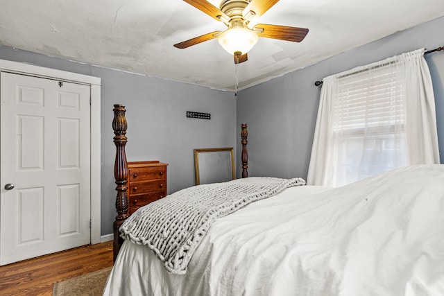 bedroom with hardwood / wood-style floors and ceiling fan