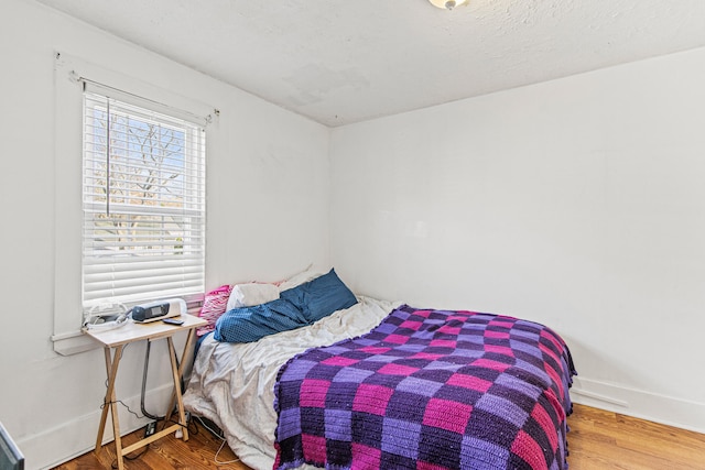 bedroom featuring wood-type flooring