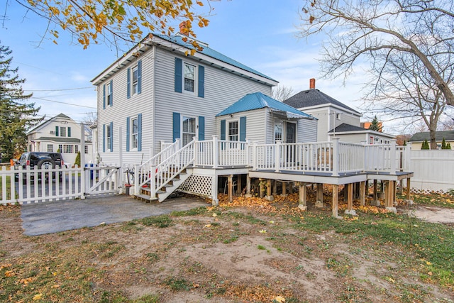 rear view of property with a deck