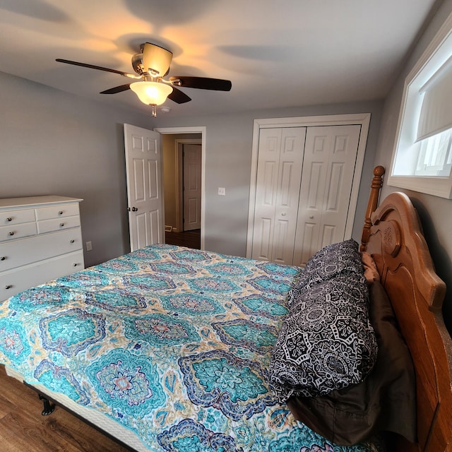 bedroom with hardwood / wood-style floors, a closet, and ceiling fan