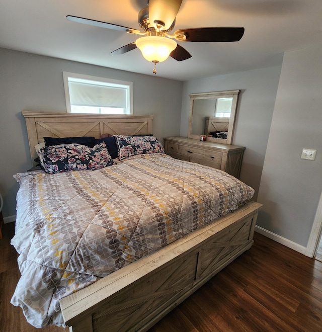 bedroom featuring ceiling fan and dark wood-type flooring