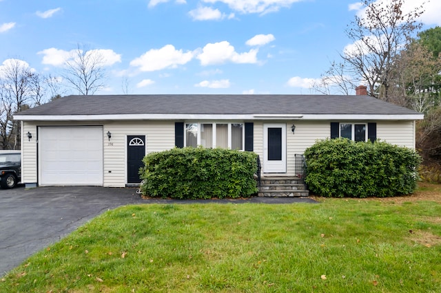 single story home featuring a garage and a front yard