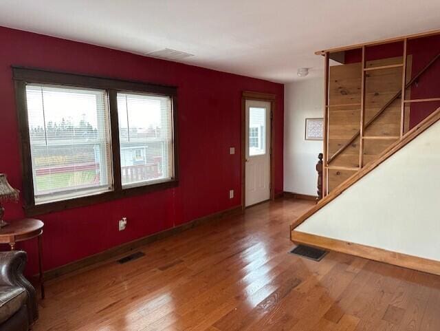 foyer with hardwood / wood-style floors and a wealth of natural light