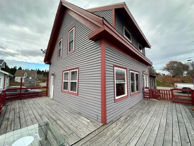 view of side of home featuring a deck