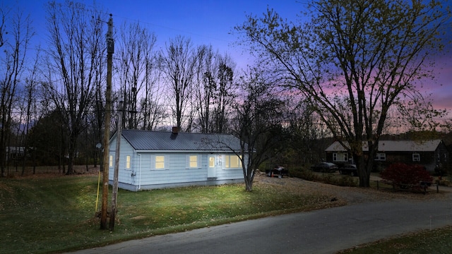 view of front of home with a lawn