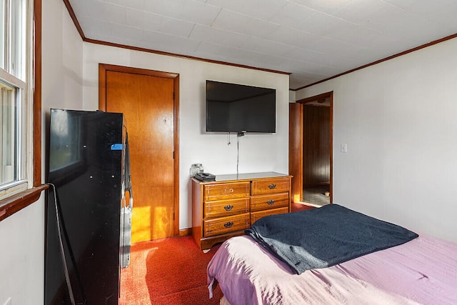 carpeted bedroom with multiple windows and ornamental molding