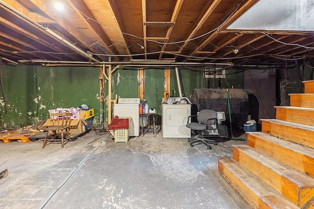 18 Sebasticook Dr, Clinton, ME 04927 - unfinished basement featuring oil tank, washer and dryer, and stairs