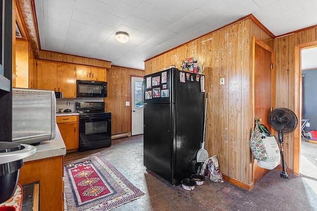 18 Sebasticook Dr, Clinton, ME 04927 - kitchen with black appliances, wood walls, brown cabinets, a baseboard radiator, and light countertops
